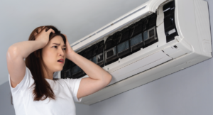 Frustrated person looking at her HVAC unit inside her home