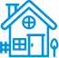 Blue icon of a house with a person sitting at a desk inside, suggesting remote work or studying from home.